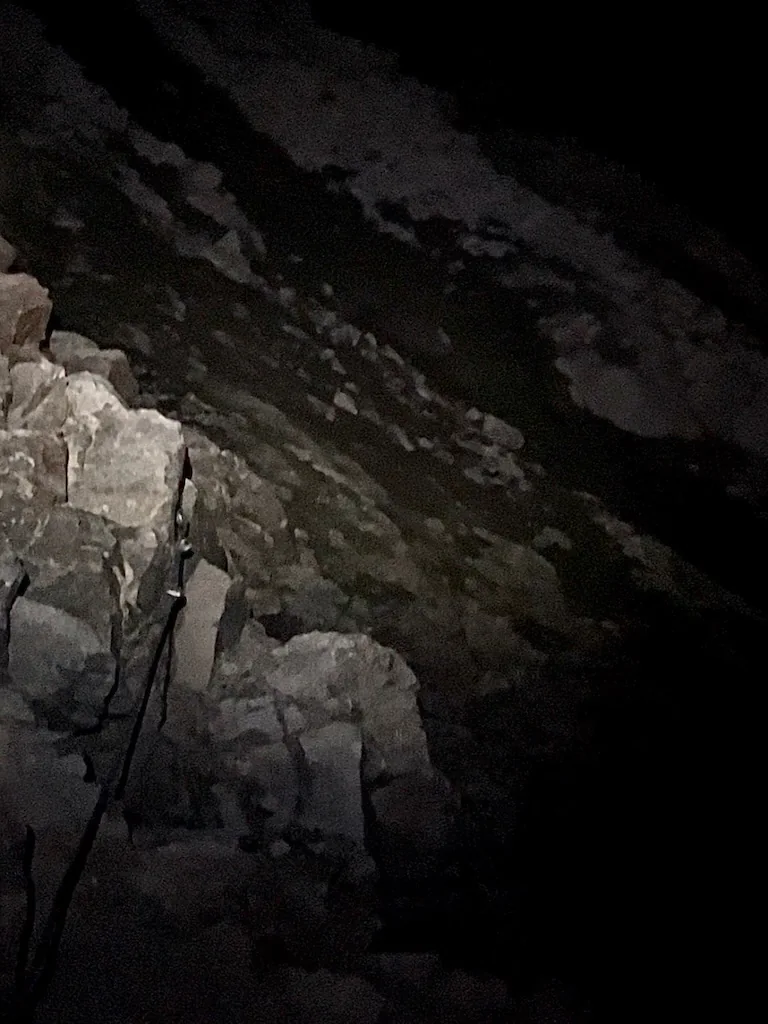 Climbing Mont Blanc via the Goûter Route 4 Crossing Grand Couloir at night while climbing Mont Blanc